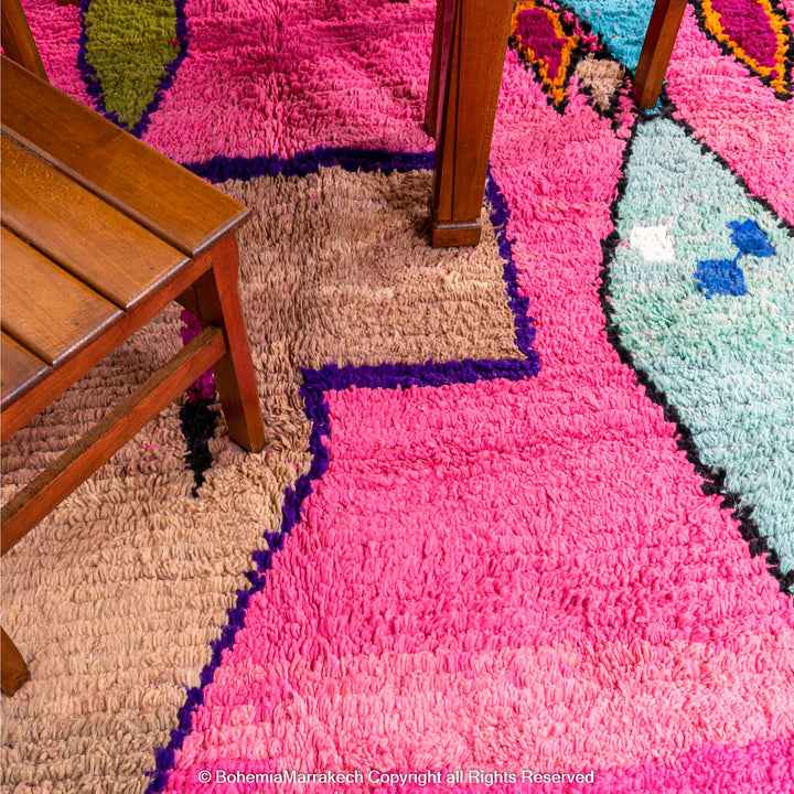 Pink Moroccan Boujaad rug with colorful geometric motifs, handmade in soft wool by Berber artisans