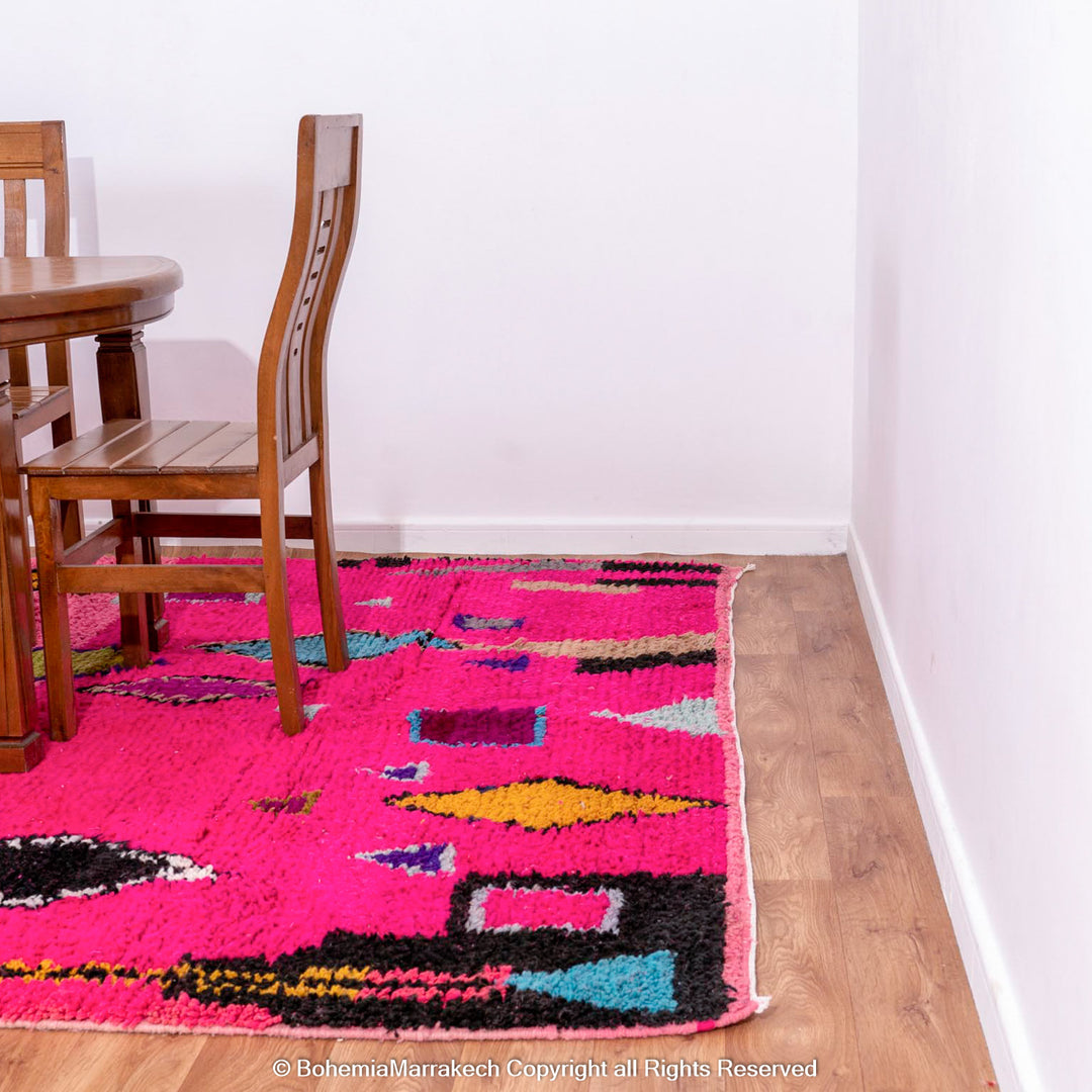Pink Moroccan Boujaad rug with colorful geometric motifs, handmade in soft wool by Berber artisans