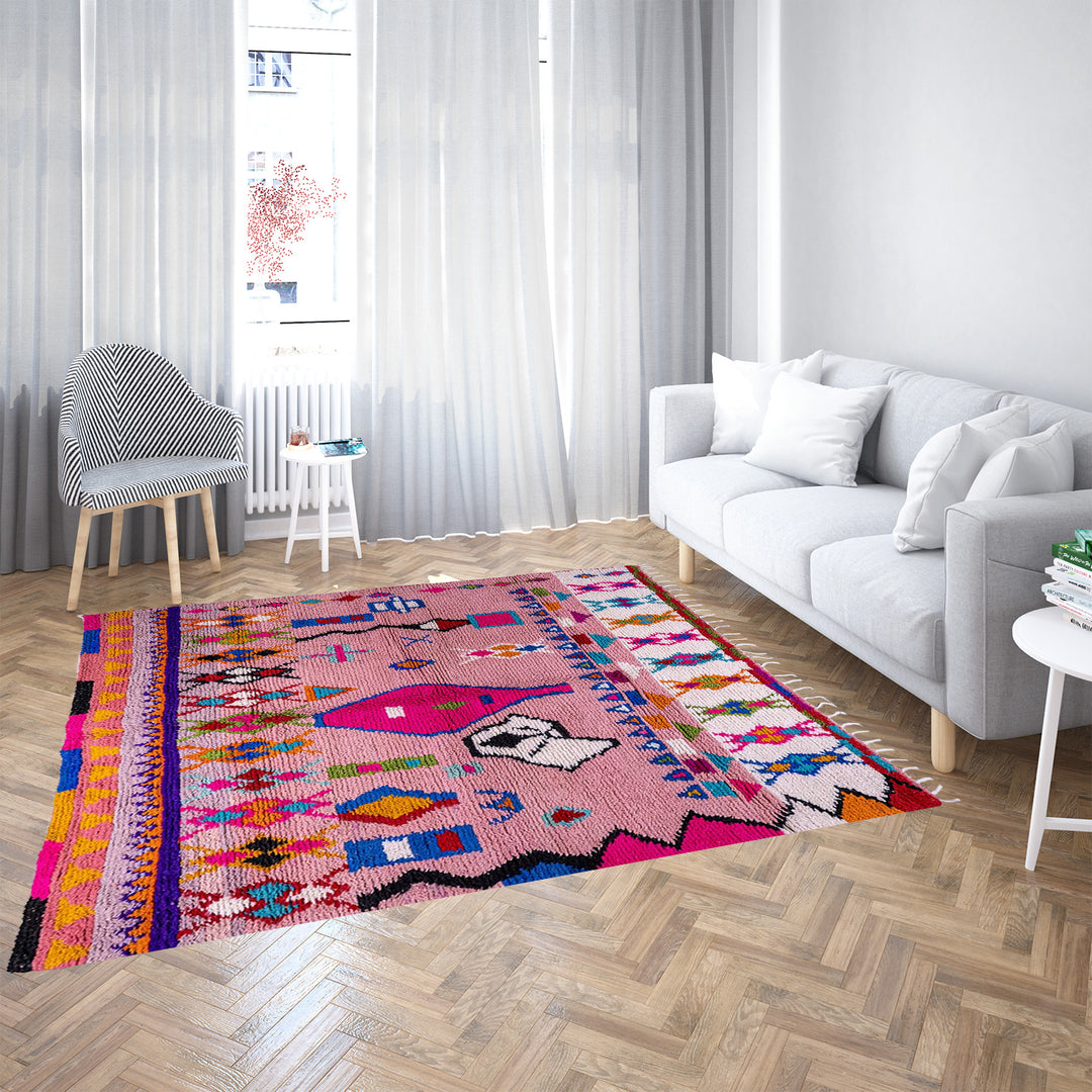Handmade pink Boujaad Moroccan rug with colorful tribal and diamond motifs on wool