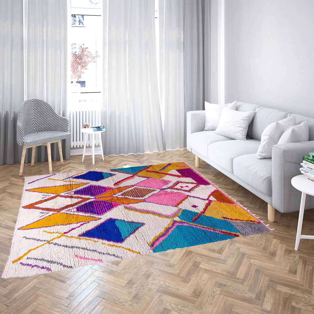 Multicolored Moroccan Boujaad Rug handmade with wool, featuring vibrant pink, yellow, and blue Berber patterns.