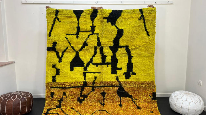 Yellow Moroccan wool rug with abstract Berber design and black line pattern