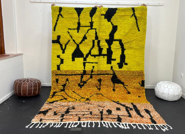 Yellow Moroccan wool rug with abstract Berber design and black line pattern