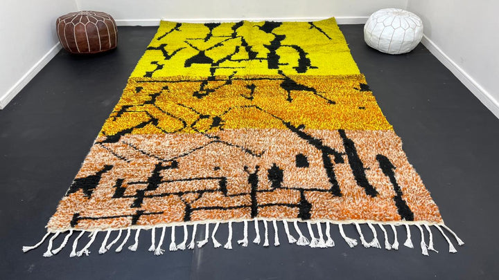 Yellow Moroccan wool rug with abstract Berber design and black line pattern
