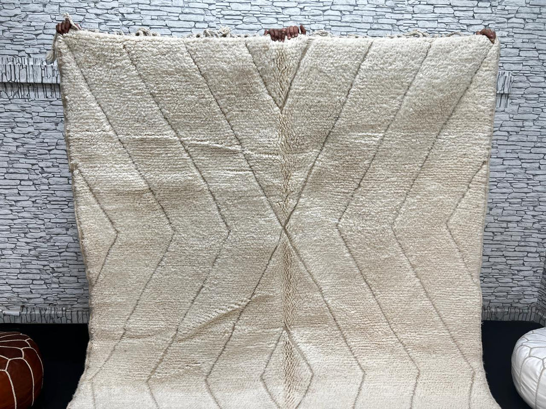 Beige Beni Ourain Moroccan wool rug with chevron line pattern and handmade Berber craftsmanship