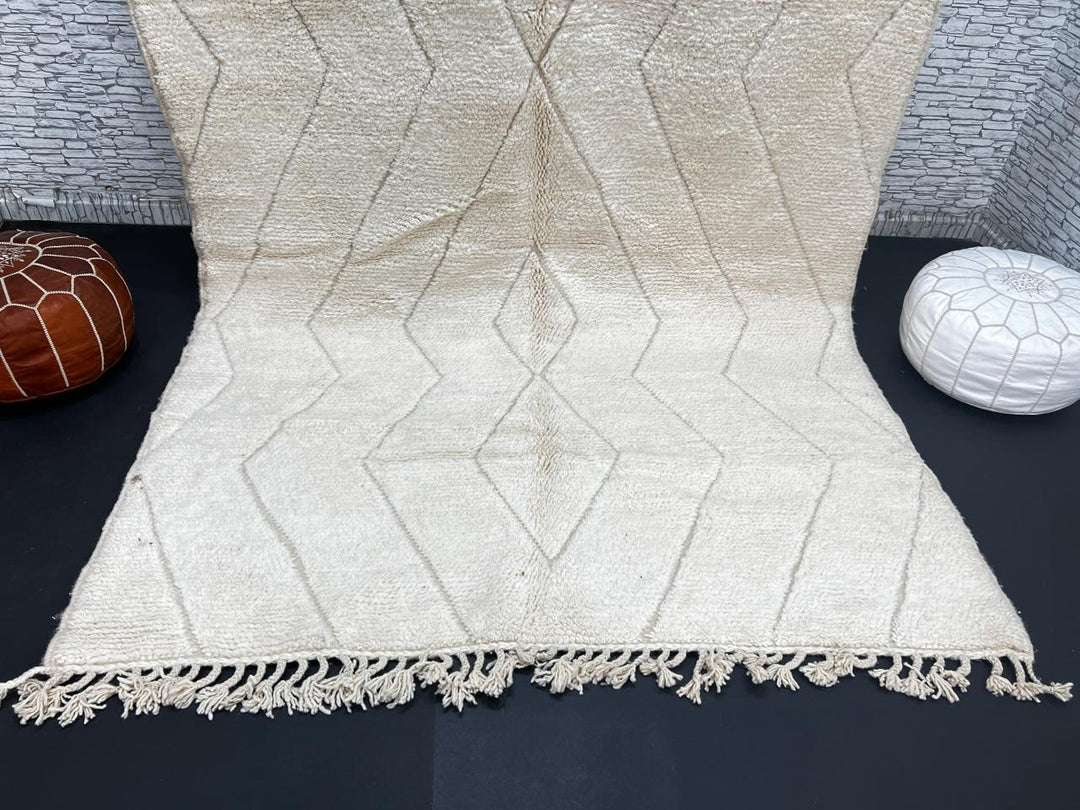 Beige Beni Ourain Moroccan wool rug with chevron line pattern and handmade Berber craftsmanship