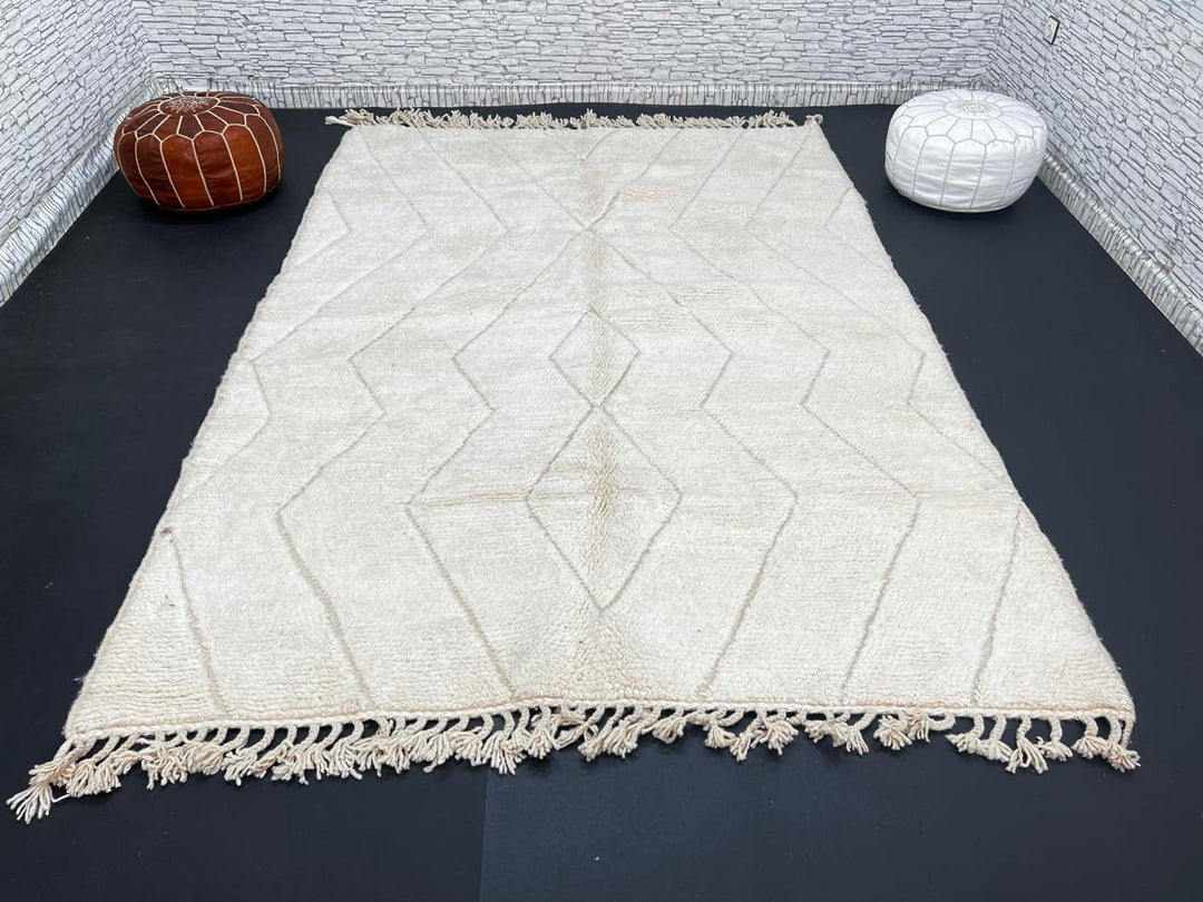 Beige Beni Ourain Moroccan wool rug with chevron line pattern and handmade Berber craftsmanship