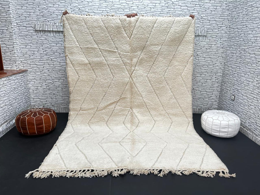 Beige Beni Ourain Moroccan wool rug with chevron line pattern and handmade Berber craftsmanship