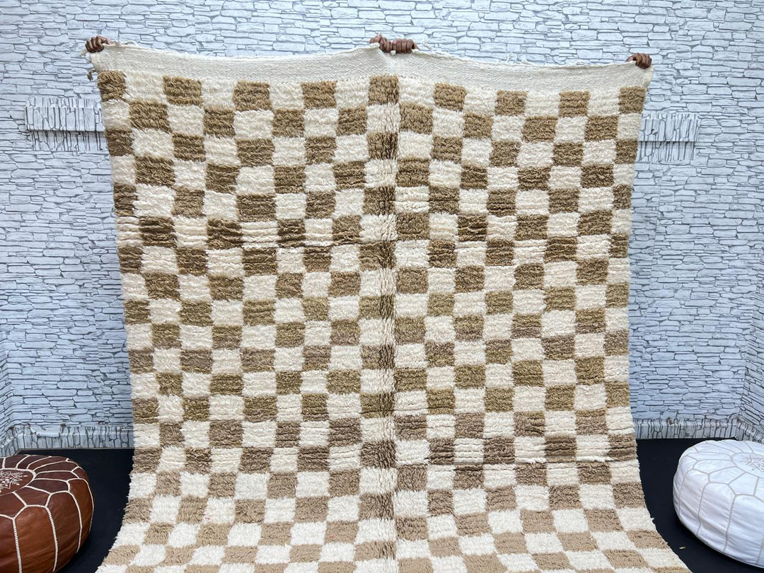 Handwoven beige and cream Moroccan wool rug with checkered design