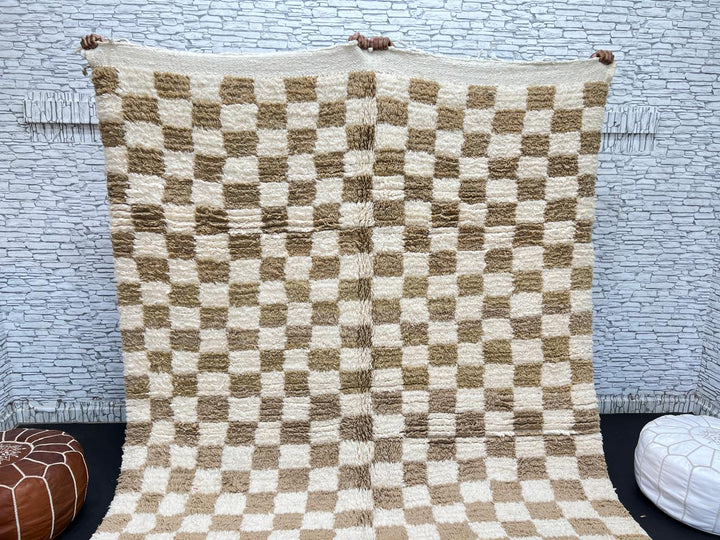 Handwoven beige and cream Moroccan wool rug with checkered design