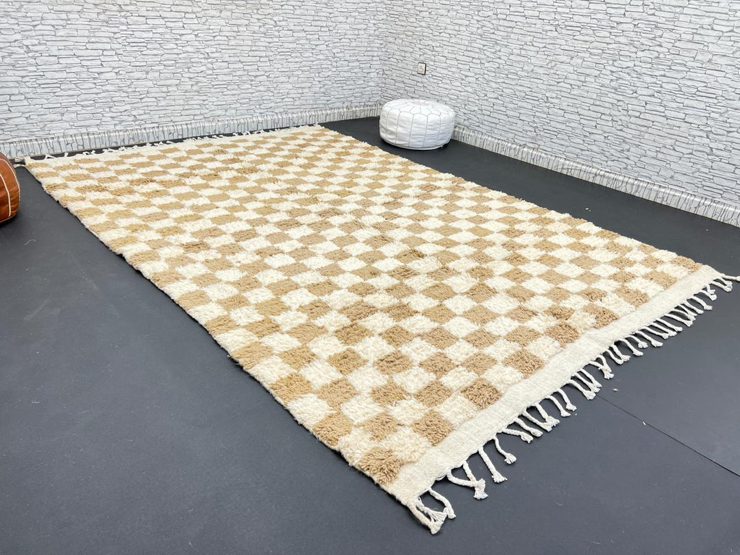 Handwoven beige and cream Moroccan wool rug with checkered design