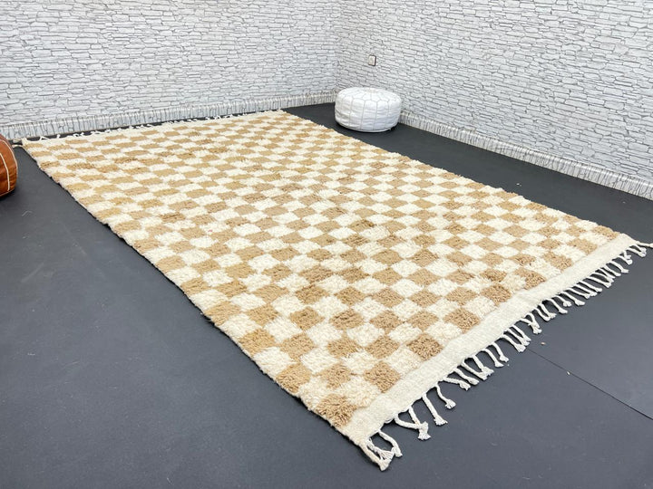 Handwoven beige and cream Moroccan wool rug with checkered design