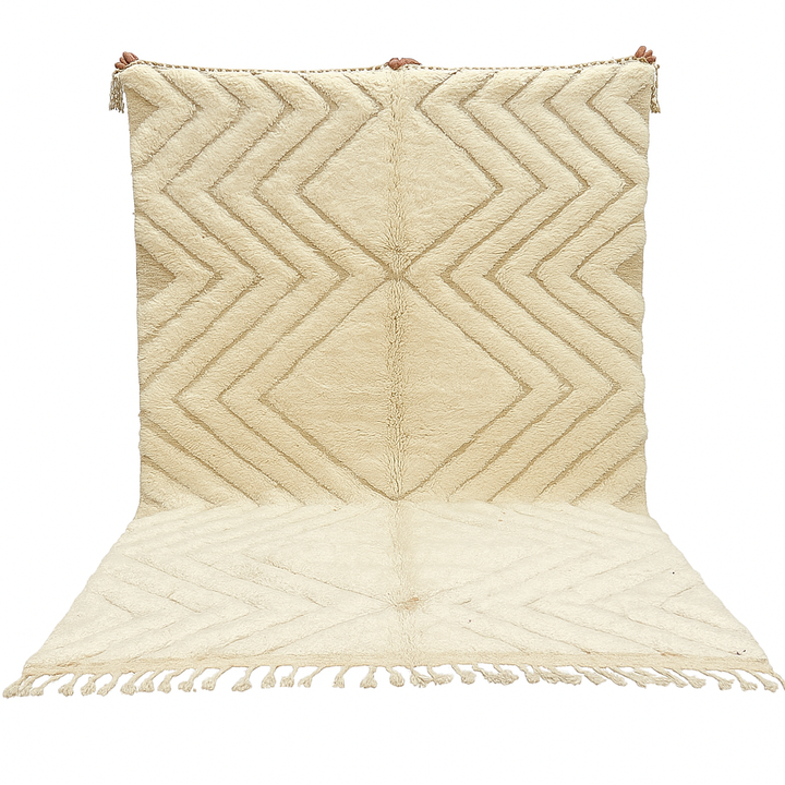 Handmade beige Moroccan wool rug with chevron geometric pattern, soft plush texture