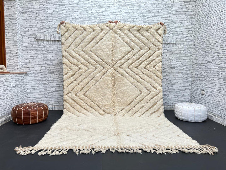 Handmade beige Moroccan wool rug with chevron geometric pattern, soft plush texture