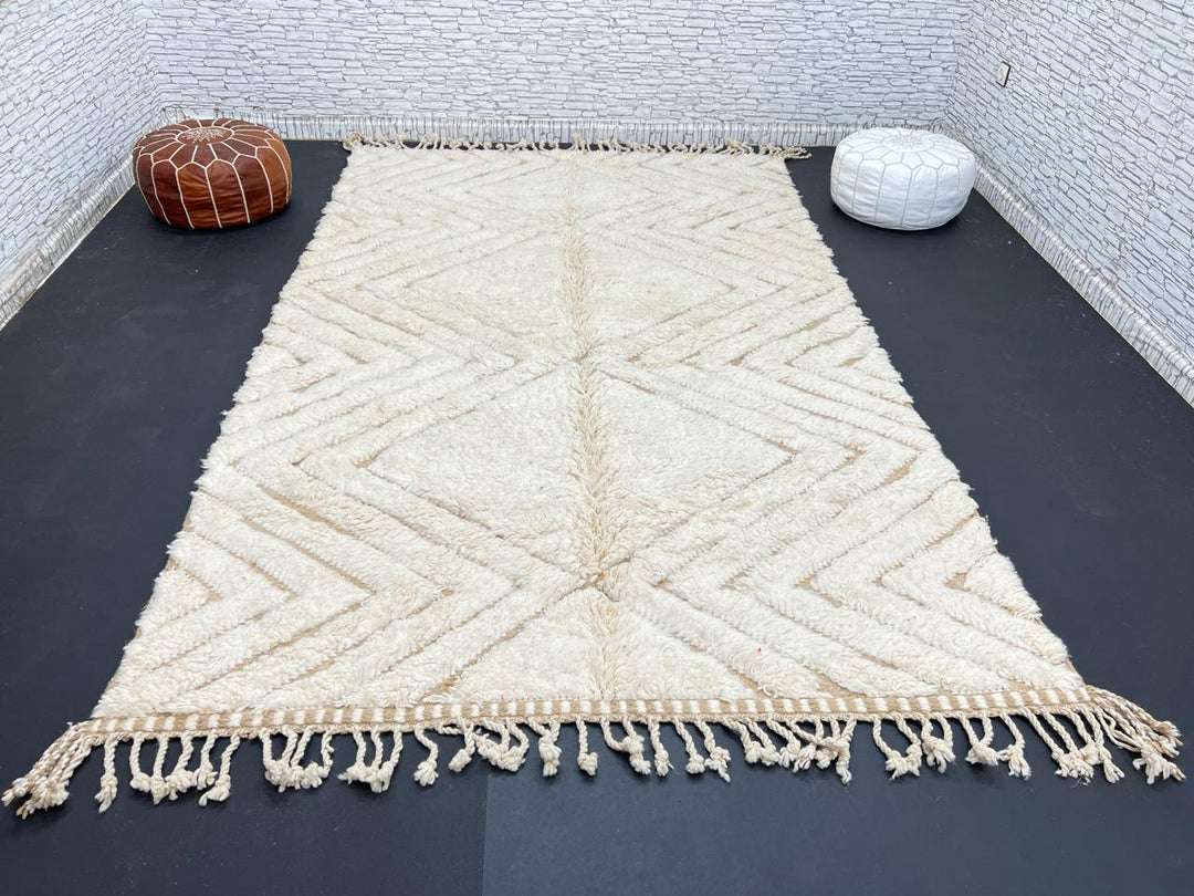 Handmade beige Moroccan wool rug with chevron geometric pattern, soft plush texture