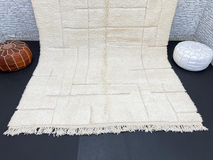 Handwoven beige Moroccan wool rug with shaved grid geometric pattern