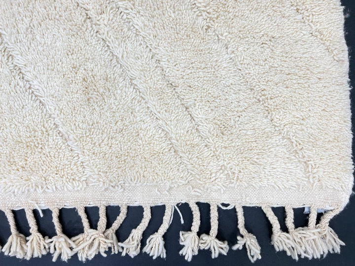 Beige minimalist Moroccan wool rug with tone-on-tone geometric design