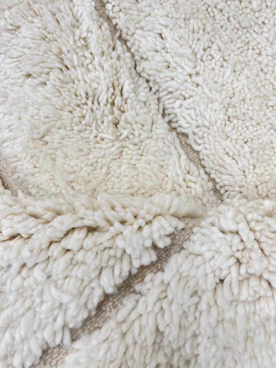 Handwoven beige Moroccan wool rug with shaved grid geometric pattern