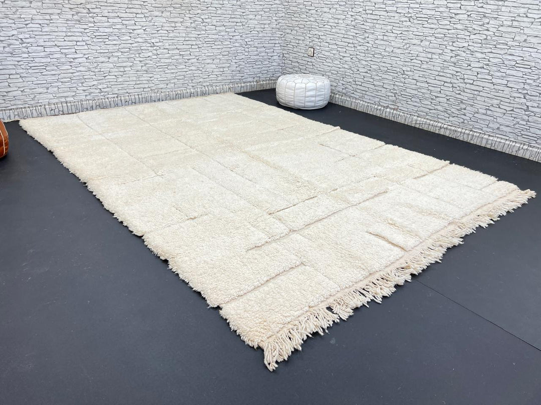 Handwoven beige Moroccan wool rug with shaved grid geometric pattern