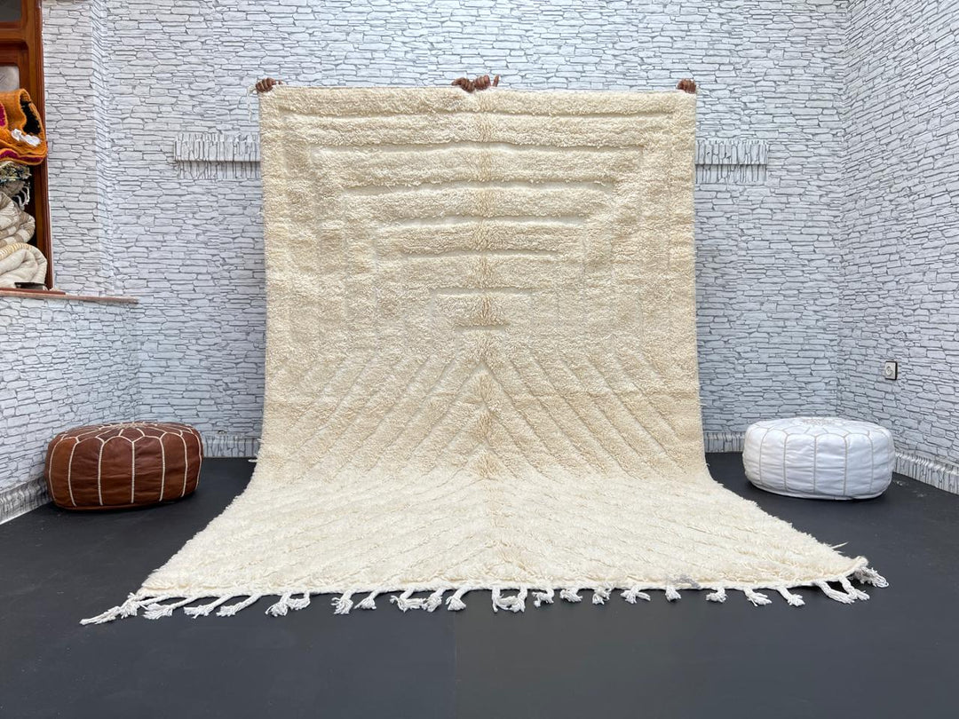 Handwoven beige Moroccan wool rug with minimalist geometric carved pattern