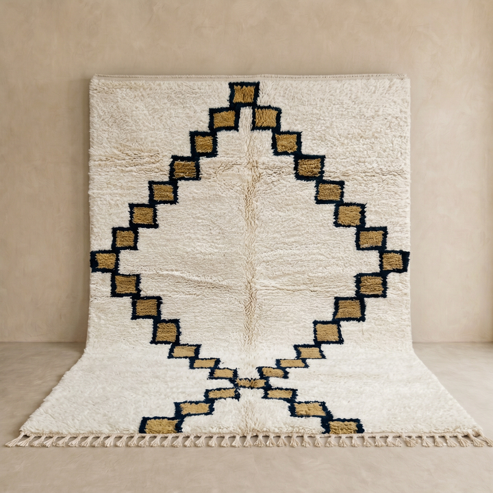 Beige Moroccan wool rug with black geometric diamond pattern, handmade by Berber artisans
