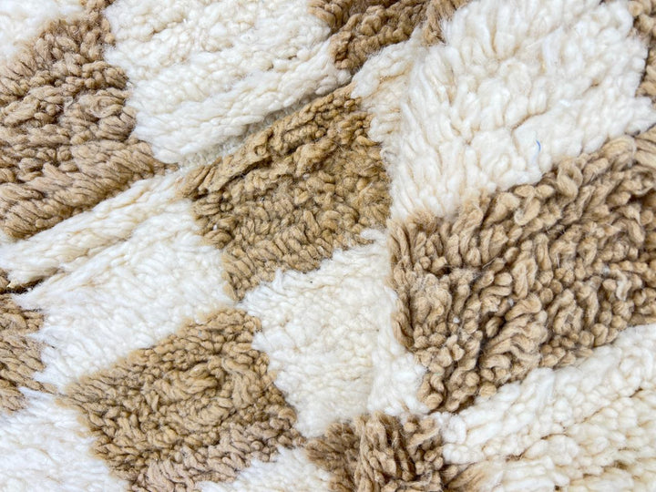 Handmade Moroccan runner rug with beige and white checkerboard pattern crafted from natural wool.