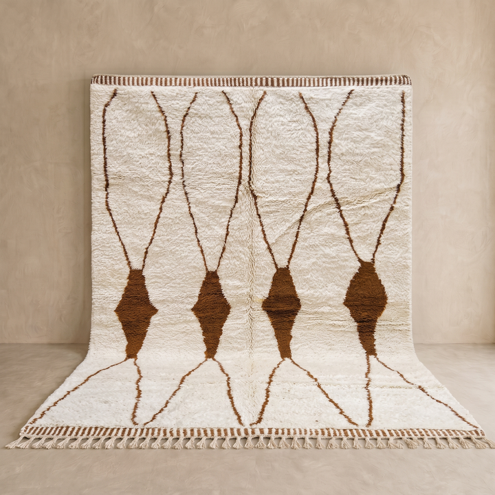 Beige and brown Moroccan wool rug with geometric design, handmade by Berber artisans using natural wool