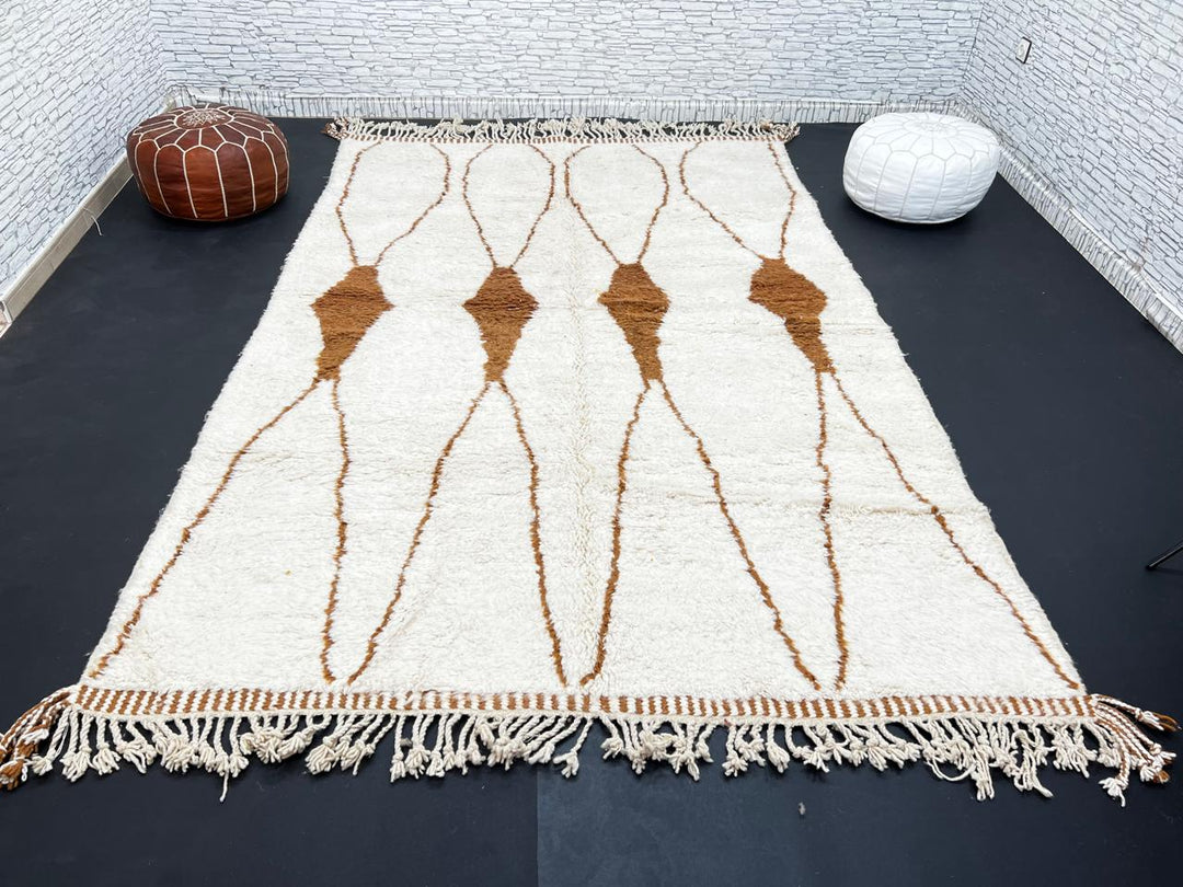 Beige and brown Moroccan wool rug with geometric design, handmade by Berber artisans using natural wool
