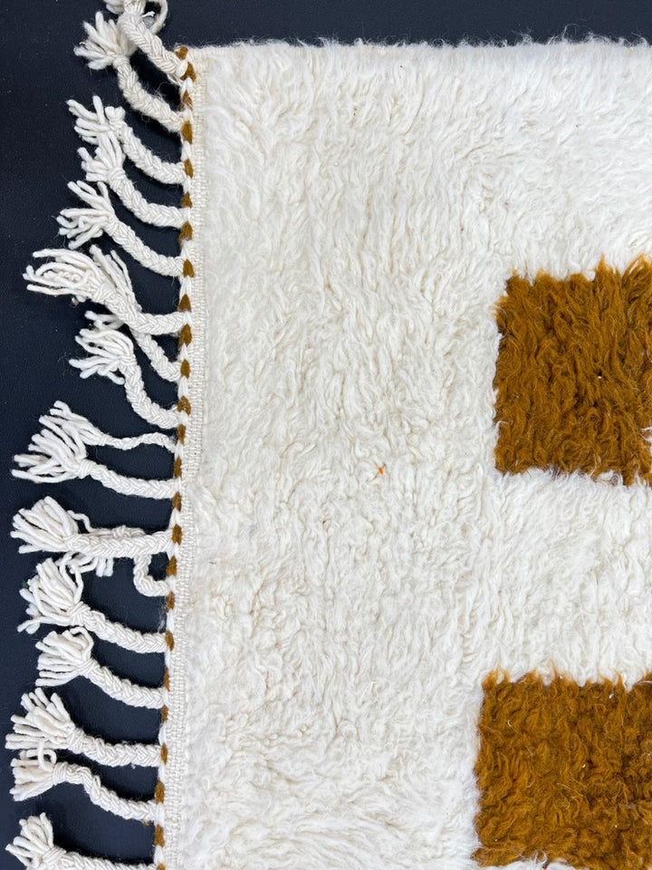 Beige and mustard handmade Moroccan wool rug with checker square pattern