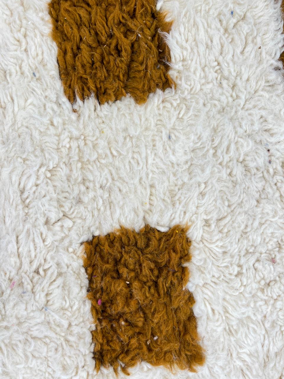 Beige and mustard handmade Moroccan wool rug with checker square pattern