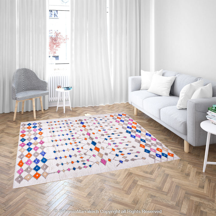 Handmade Moroccan rug with colorful diamond pattern on ivory wool background