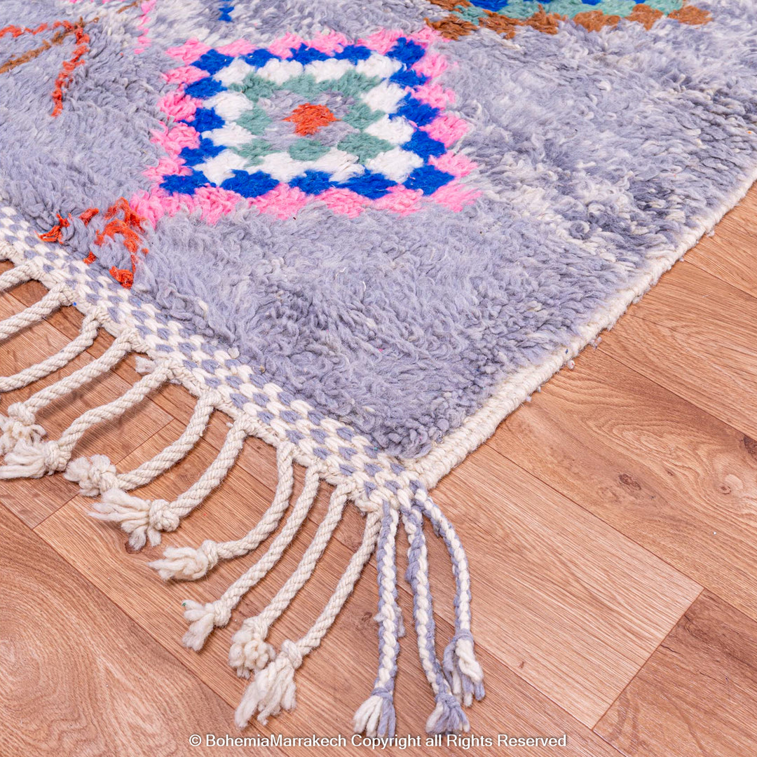 Colorful diamond Moroccan wool rug with grey shag background