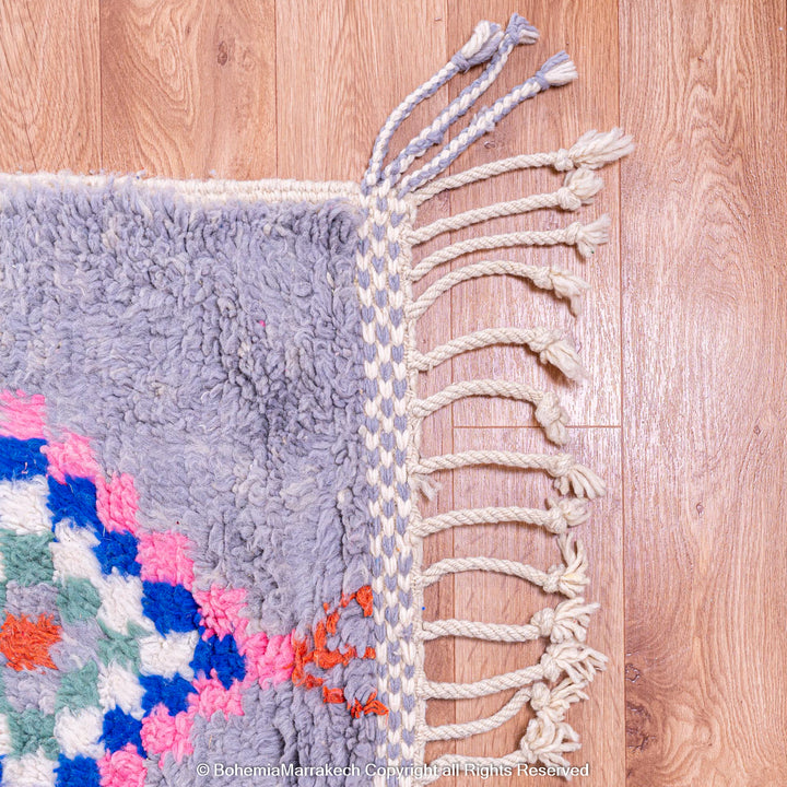 Colorful diamond Moroccan wool rug with grey shag background