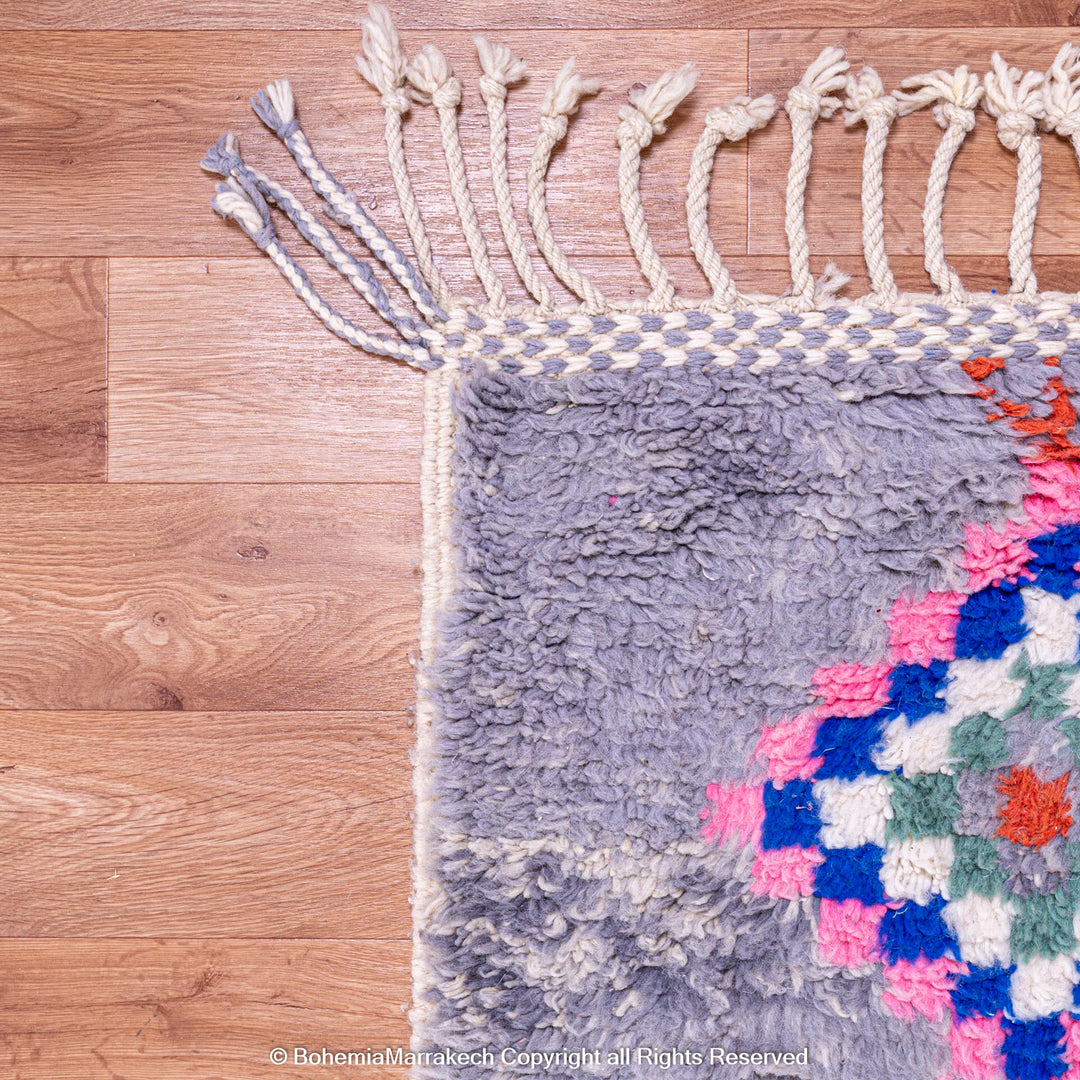 Colorful diamond Moroccan wool rug with grey shag background