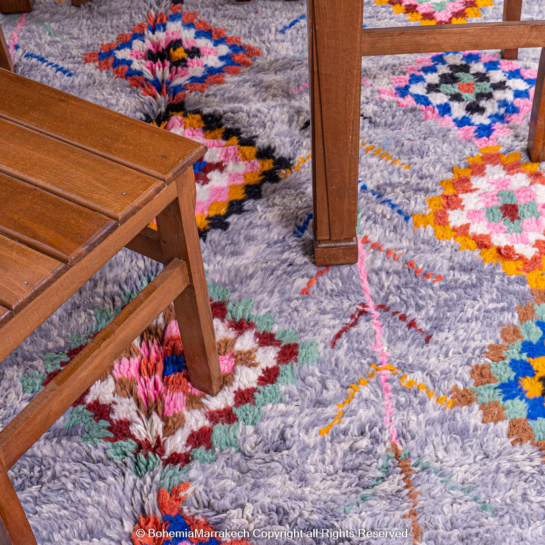 Colorful diamond Moroccan wool rug with grey shag background