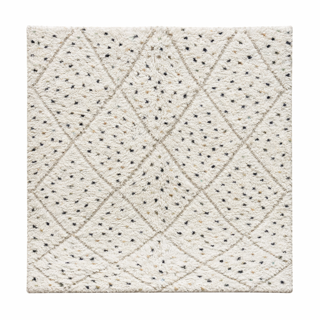 Handmade Moroccan wool rug with ivory base, diamond Berber pattern and subtle speckled accents. Soft plush texture, artisan crafted.