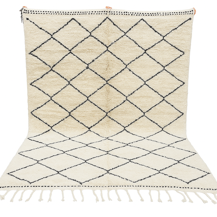 Handmade Moroccan Beni Ourain wool rug with black diamond pattern on ivory background