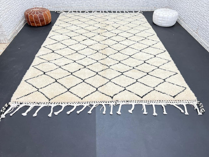 Handmade Moroccan Beni Ourain wool rug with black diamond pattern on ivory background