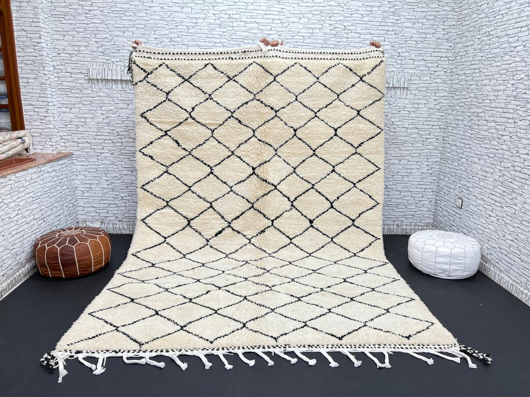 Handmade Moroccan Beni Ourain wool rug with black diamond pattern on ivory background
