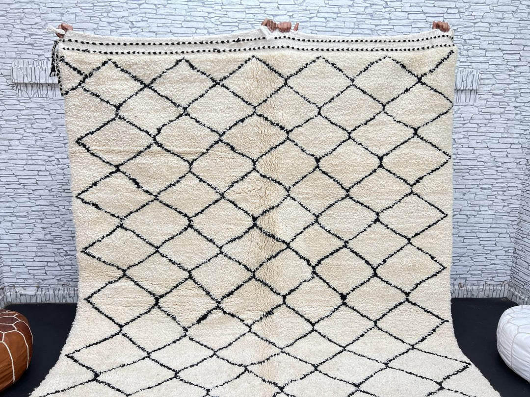 Handmade Moroccan Beni Ourain wool rug with black diamond pattern on ivory background