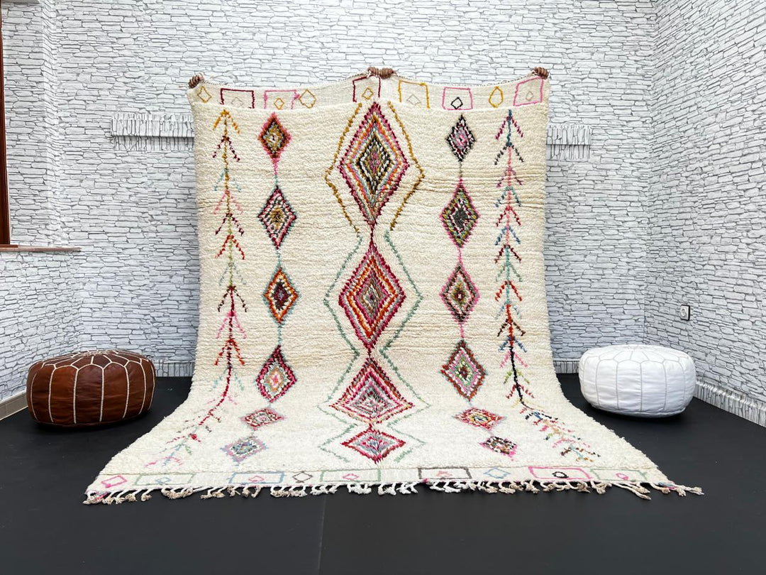 Beni Ourain Moroccan wool rug with cream background and colorful diamond motifs, handmade by Berber artisans