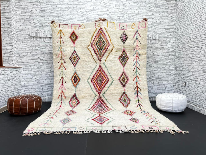 Beni Ourain Moroccan wool rug with cream background and colorful diamond motifs, handmade by Berber artisans