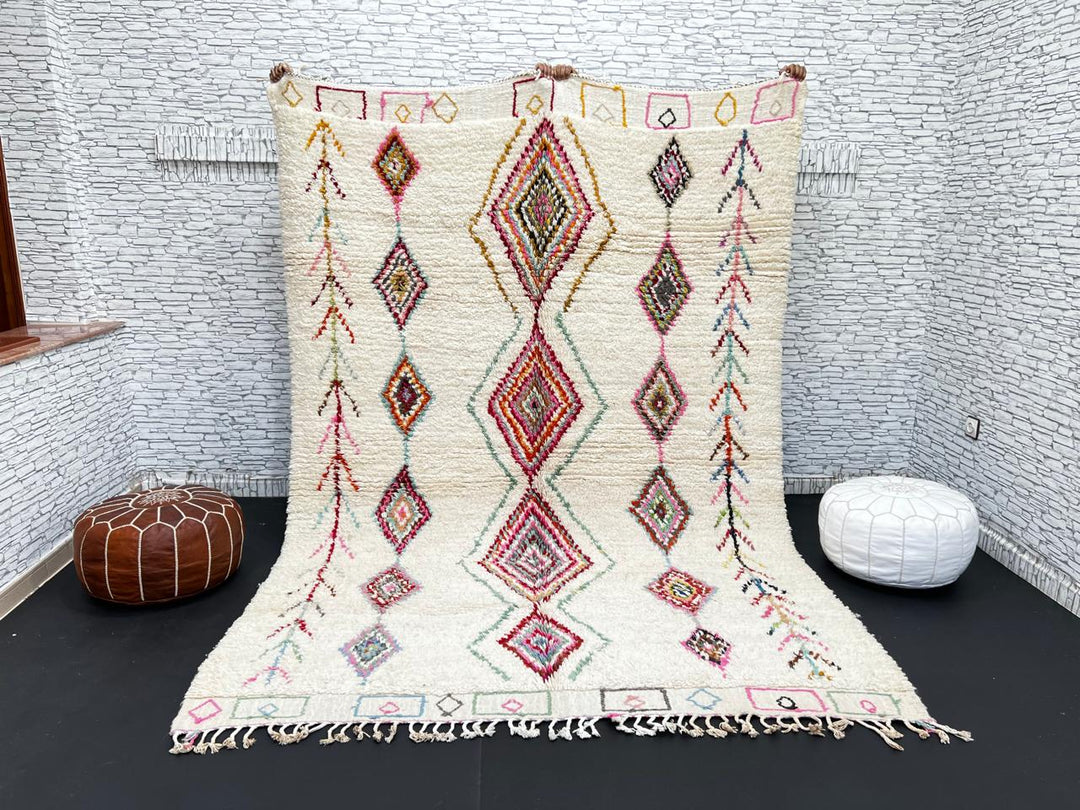Beni Ourain Moroccan wool rug with cream background and colorful diamond motifs, handmade by Berber artisans