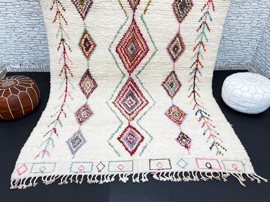 Beni Ourain Moroccan wool rug with cream background and colorful diamond motifs, handmade by Berber artisans