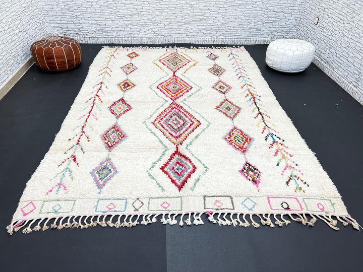 Beni Ourain Moroccan wool rug with cream background and colorful diamond motifs, handmade by Berber artisans