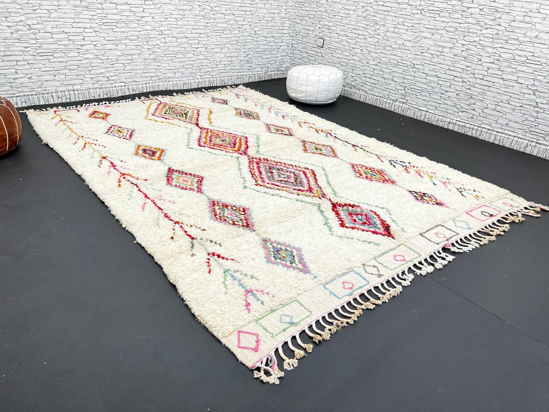 Beni Ourain Moroccan wool rug with cream background and colorful diamond motifs, handmade by Berber artisans