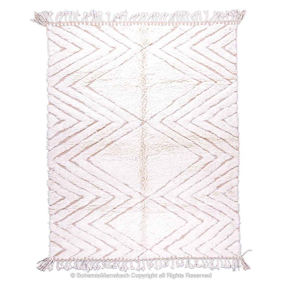 Handmade Beni Ourain Moroccan wool rug with geometric zigzag pattern in soft beige tones, perfect for modern living spaces.