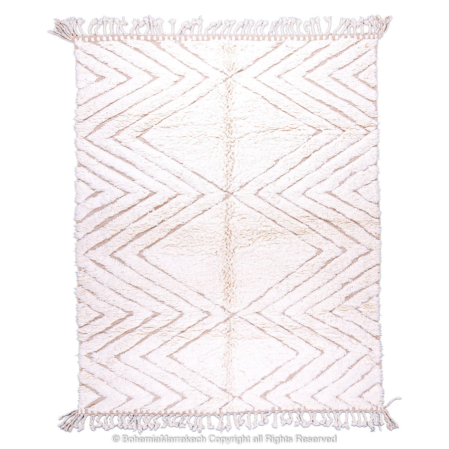 Handmade Beni Ourain Moroccan wool rug with geometric zigzag pattern in soft beige tones, perfect for modern living spaces.