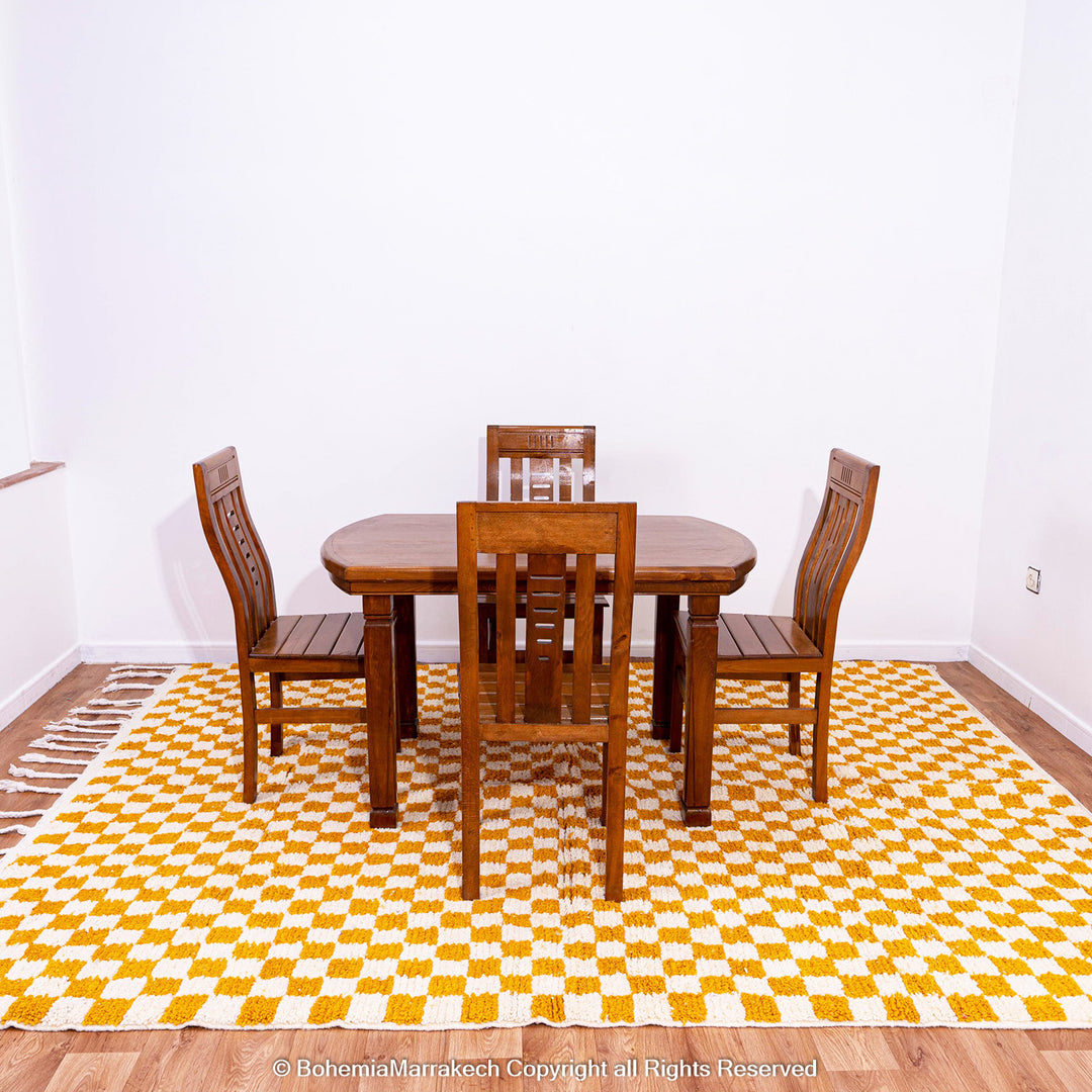 Handwoven Moroccan rug in yellow and white checkerboard pattern, crafted from soft wool