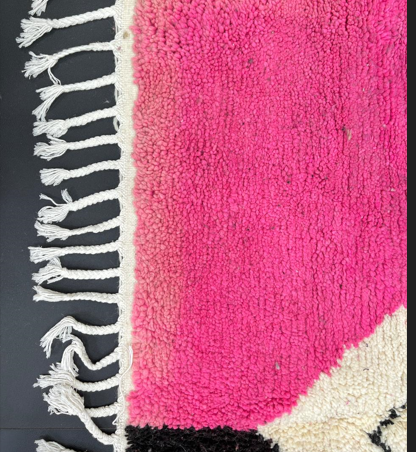 Handmade black, pink, and white Moroccan wool runner rug with large geometric diamond design
