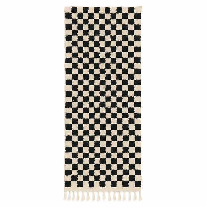 Handmade black and white checkered Moroccan runner rug crafted from natural wool.